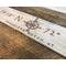 A personalized vacation home sign. It shows the location of a ski resort with the longitude-latitude coordinates.  